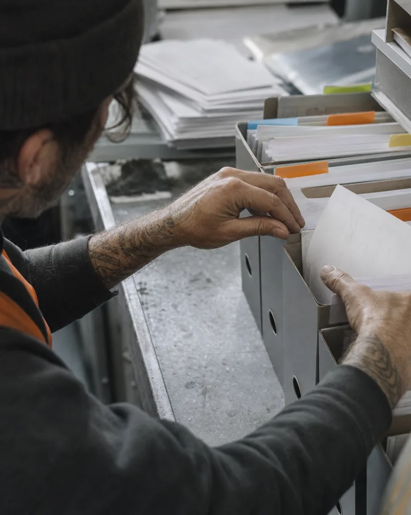 Capture manager marking contract end dates on a wall planner